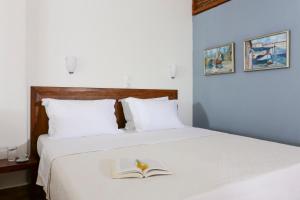A bed or beds in a room at 9 Muses - Paros