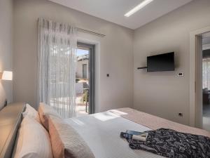 Postel nebo postele na pokoji v ubytování VILLA NIBA