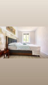 En eller flere senge i et værelse på Maison de Maître