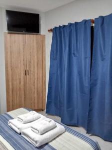Hotel El Paraiso Boutique客房内的一张或多张床位