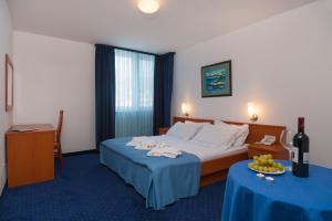 Ένα ή περισσότερα κρεβάτια σε δωμάτιο στο Hotel Rotondo