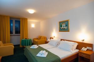 Ένα ή περισσότερα κρεβάτια σε δωμάτιο στο Hotel Rotondo