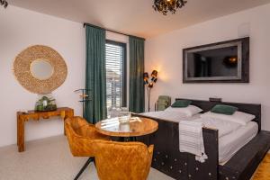 Postel nebo postele na pokoji v ubytování KOREK Mikulov apartmán