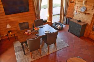 a dining room with a table and chairs at Feriendorf Blauvogel Blauvogel 054 in Hasselfelde