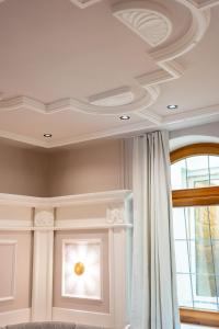 a coffered ceiling with a window in a room at Maria Luise in Bad Harzburg