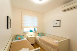 En eller flere senger på et rom på Apartment Lividus A7