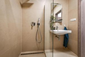 a bathroom with a shower and a sink at Apartmán La Glace s bezplatným parkoviskom in Martin