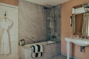 a bathroom with a sink and a shower and a sink at Oakley Court in Windsor