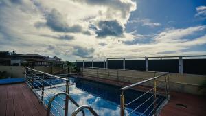 a view of a swimming pool on a balcony at Horizon Lodge in Diamond Island +5 photos