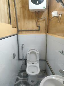 a small bathroom with a toilet and a sink at Nhà hàng Homestay Hương Tây Bắc in Trạm Tấu +22 photos