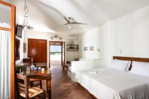 A bed or beds in a room at 9 Muses - Paros