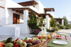 a table with a bunch of fruits and vegetables on it at 9 Muses - Paros in Parikia