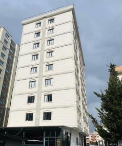a white building with windows on the side of it at Educity Suite and Hotels Atasehir in Istanbul