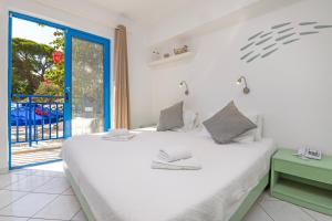 Postel nebo postele na pokoji v ubytování Hotel Nathalie