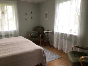 Postel nebo postele na pokoji v ubytování Holms Heagård