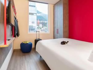 Postel nebo postele na pokoji v ubytování ibis budget Bogota Marly