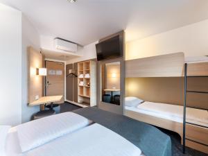 Postel nebo postele na pokoji v ubytování B&B HOTEL St-Pölten