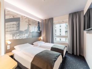 Postel nebo postele na pokoji v ubytování B&B HOTEL St-Pölten + 24 fotografií