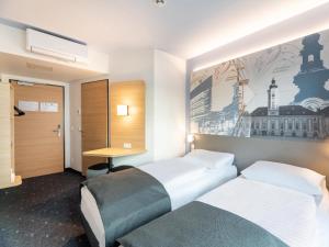 B&B HOTEL St-Pölten客房内的一张或多张床位