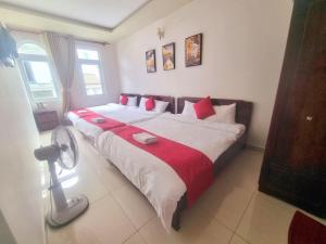 Postel nebo postele na pokoji v ubytování Conico Hotel at Dalat