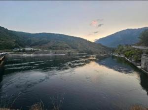a view of a river with mountains in the background at Borbardha the 7 xhuxhat in Tropojë