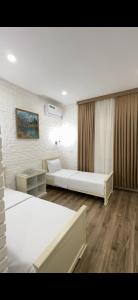 Katil atau katil-katil dalam bilik di Khan Orda Hotel