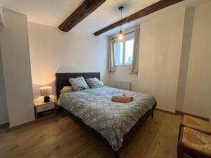 a bedroom with a bed with a stuffed animal on it at Superbe T2 Bolquère in Bolquere Pyrenees 2000