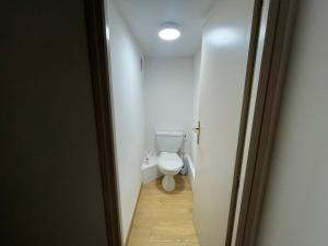 a small bathroom with a toilet in a hallway at Superbe T2 Bolquère in Bolquere Pyrenees 2000