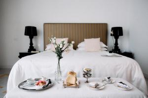 Letto o letti in una camera di Palazzo del Corso – Boutique Hotel