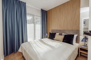 Ένα ή περισσότερα κρεβάτια σε δωμάτιο στο Stay4U Apartments Belle View