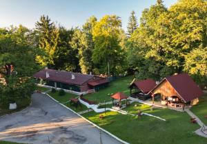 an aerial view of a large house with a yard at Centrul de Echitatie Poiana Brasov in Poiana Brasov