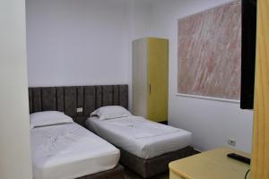 Postel nebo postele na pokoji v ubytování Elite Hotel