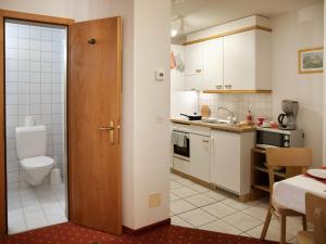 a small kitchen with a toilet and a sink at Apartment Chalet Abendrot apARTments-11 by Interhome in Grindelwald