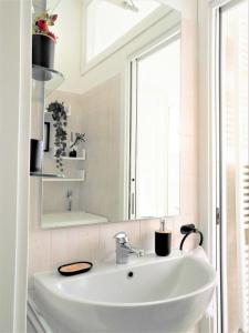 a white sink in a bathroom with a window at Grigna Casa della quiete Cremeno LECCO COMO LAKE in Cremeno +73 photos