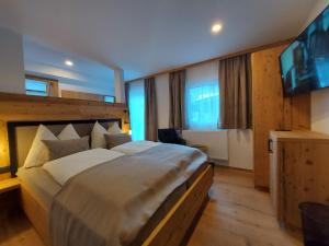 Postel nebo postele na pokoji v ubytování Hotel Gasthof Walcher