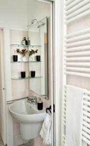 a bathroom with a sink and a mirror at Grigna Casa della quiete Cremeno LECCO COMO LAKE in Cremeno