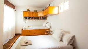 Katil atau katil-katil dalam bilik di Apartamento O Cobo Miño