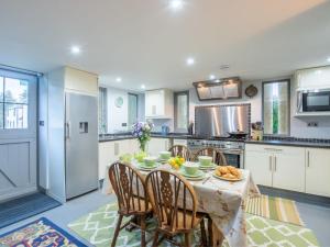 a kitchen with a table with food on it at Holiday Home The Granary by Interhome in Invermoriston