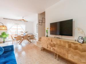 a living room with a large flat screen tv on a wall at Holiday Home Canción de mar by Interhome in Creixell
