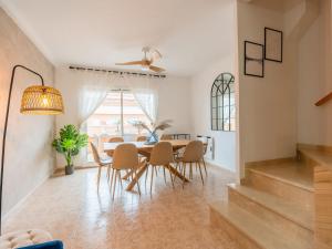 a dining room with a table and chairs at Holiday Home Canción de mar by Interhome in Creixell +53 photos