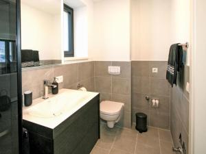 a bathroom with a sink and a toilet at Apartment Wibmer by Interhome in Axams