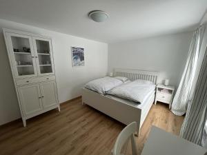 Ένα ή περισσότερα κρεβάτια σε δωμάτιο στο Apartment Oberbergstrasse 91b by Interhome