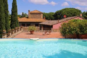 a large swimming pool in front of a house at Podere Casato 2 Hills View, Pool, Wifi Tuscany in Montespertoli
