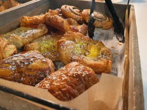 a box of pastries sitting on a table at Mitchell Hall in Cranfield