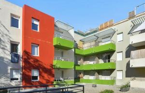 an apartment building with a red and green building at 100 - Le Floréa - Studio - 2 pers - Parking - Wifi in Castelnau-le-Lez