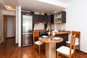 A kitchen or kitchenette at Corralejo Main Street Apartment