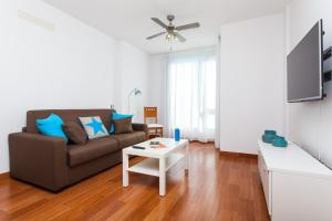 A television and/or entertainment centre at Corralejo Main Street Apartment