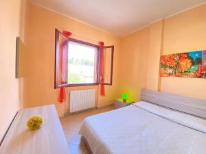 a bedroom with a white bed and a window at Armonia Machiavelli House Gallipoli in Gallipoli +59 photos