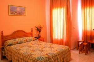 Postel nebo postele na pokoji v ubytování Hotel Limas
