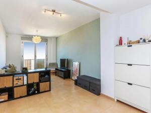 a living room with a couch and a table at Apartment Maxxie by Interhome in Benicarló